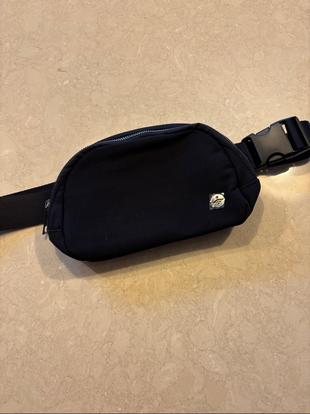 Black Halara waist bag.